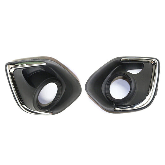 A pair of front bumper fog light bezel trims for the 2013-2015 for Mitsubishi Outlander Sport.