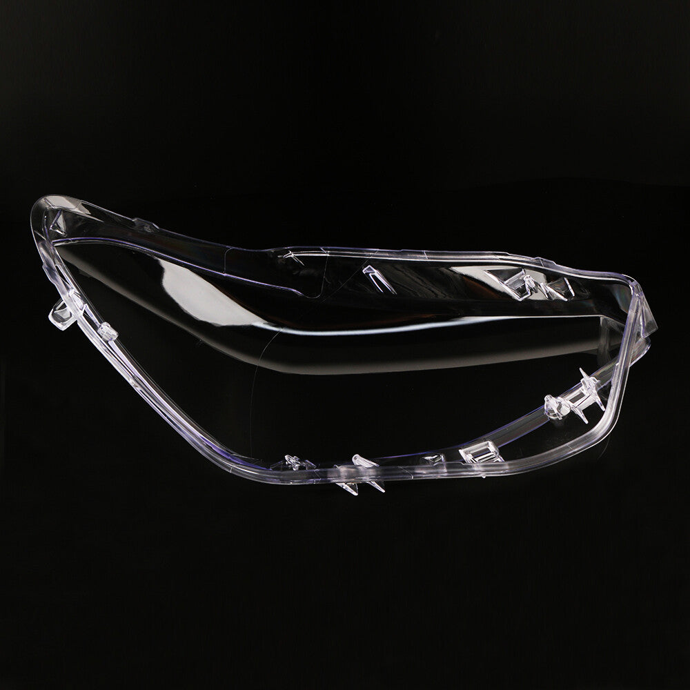 A pair of headlight lens protective covers with transparent lenses for BMW F20 2012-2014.