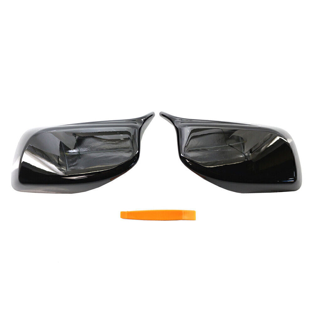 A pair of rearview mirror cover trims suitable for 2004-2007 for BMW E60/E61 models, with removal tools.