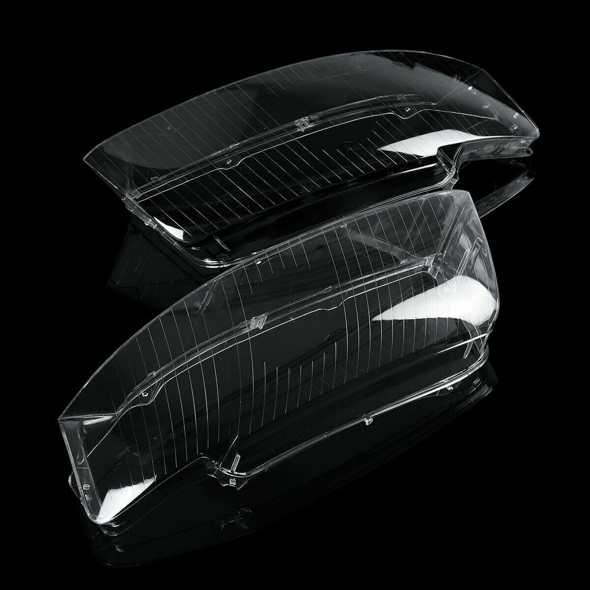 A pair of clear lens covers for left and right headlights, suitable for Audi A4 and B6 models from 2002 to 2005.
